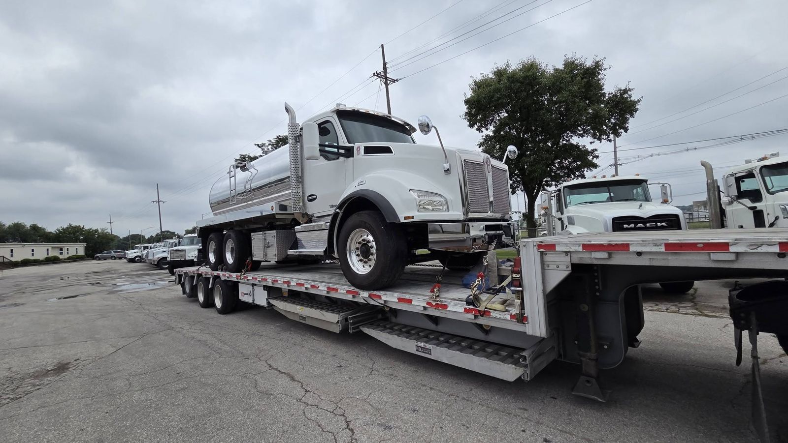 Truck loaded on the step deck, with the drop deck used for its height.
